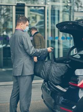 Chauffeur unloading bags at the airport